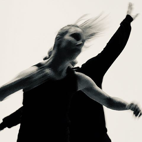 Two people are captured in motion
