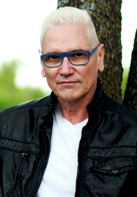 David Gately headshot in leather jacket and white shirt