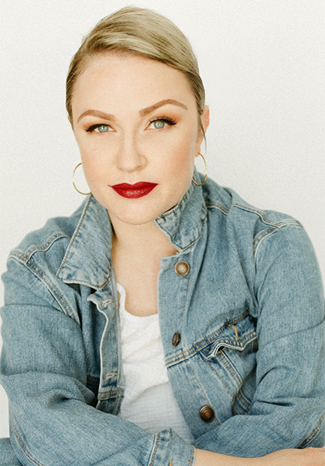 Headshot of Lindsey Klein smiling with an off-white background