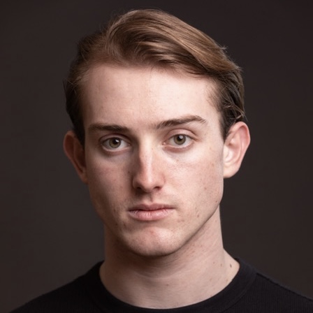 Samuel Patrick headshot: posing with dark background