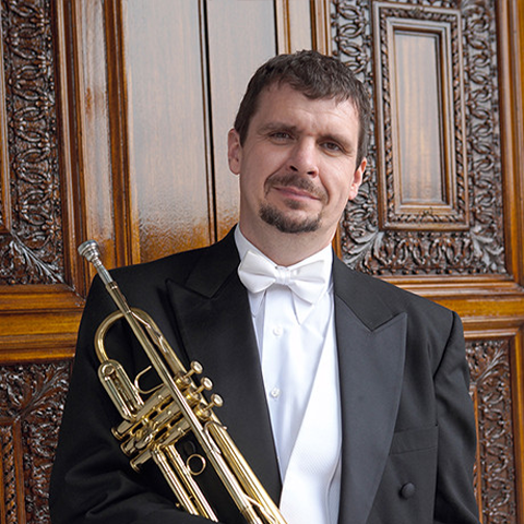 Joseph Foley holding trumpet