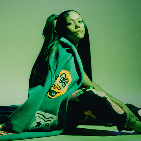 Laura Bibbs posing with a green light overlay