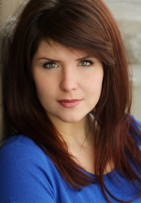 Rosie Ward headshot—wearing a blue long sleeve shirt.