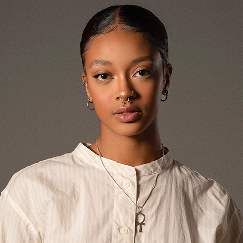 Drew Leah Allen headshot; wearing a white shirt