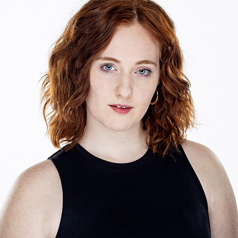 Miriam Peck Marwood headshot: wearing black shirt in front of white background 