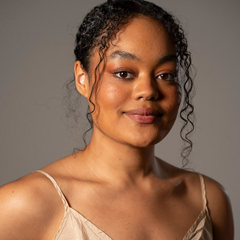 Mia Muntu headshot; wearing beige tank top