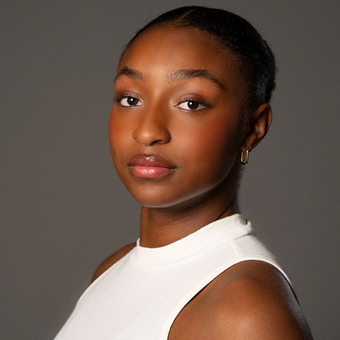 Olivia Mozie headshot; wearing a white top