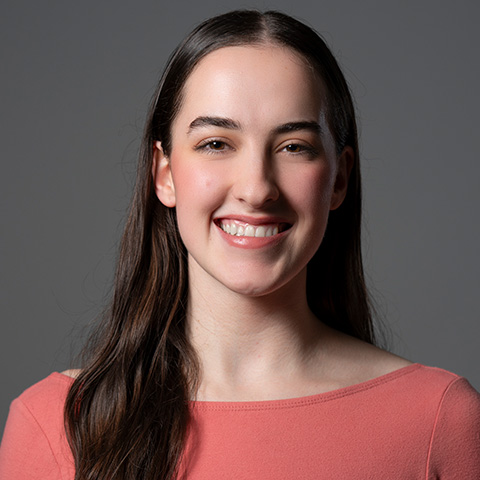Penn Burrall headshot; wearing pink shirt