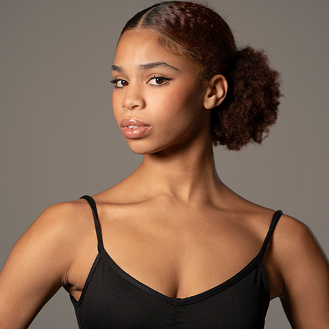 Rhapsody Stiggers headshot; wearing a black tank top
