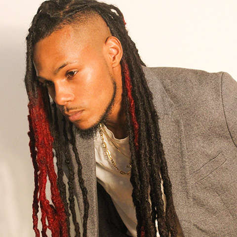 Jahmo Chevez hedashot: wearing gray jacket in front of white wall