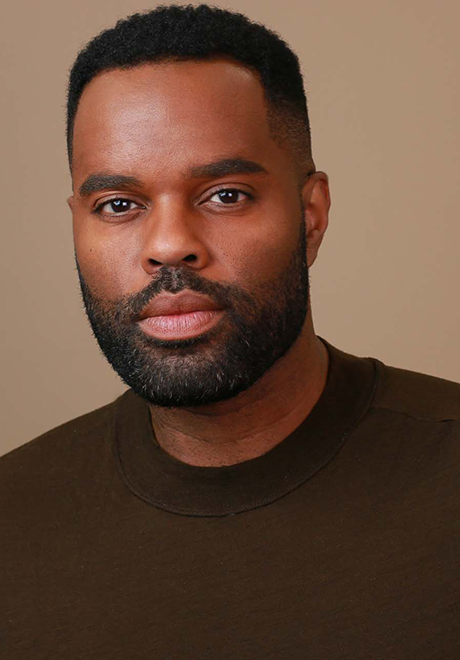 De'Lon Grant headshot: wearing brown shirt