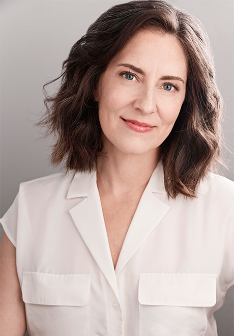 Zipporah Peddle headshot: smiling and wearing a white top