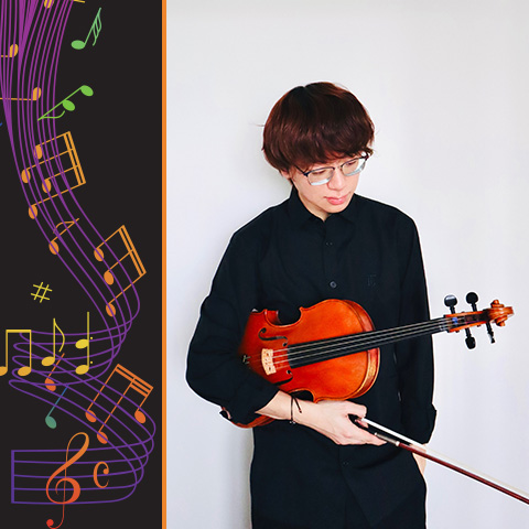 a musician stands against a wall holding their instrument 
