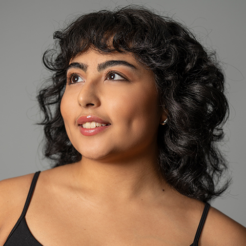 Yazmine Akamine headshot. Wearing a black tank top.