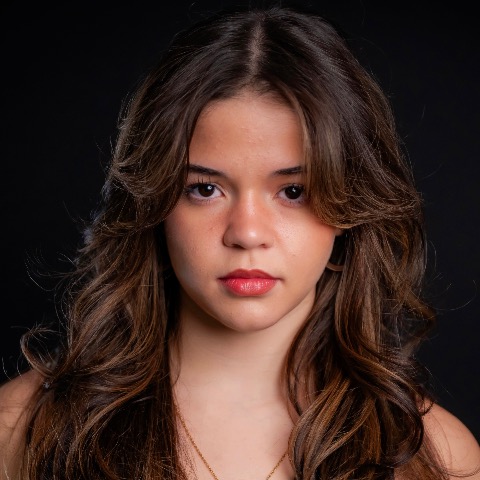 Cristina Tomé headshot in front of a black background