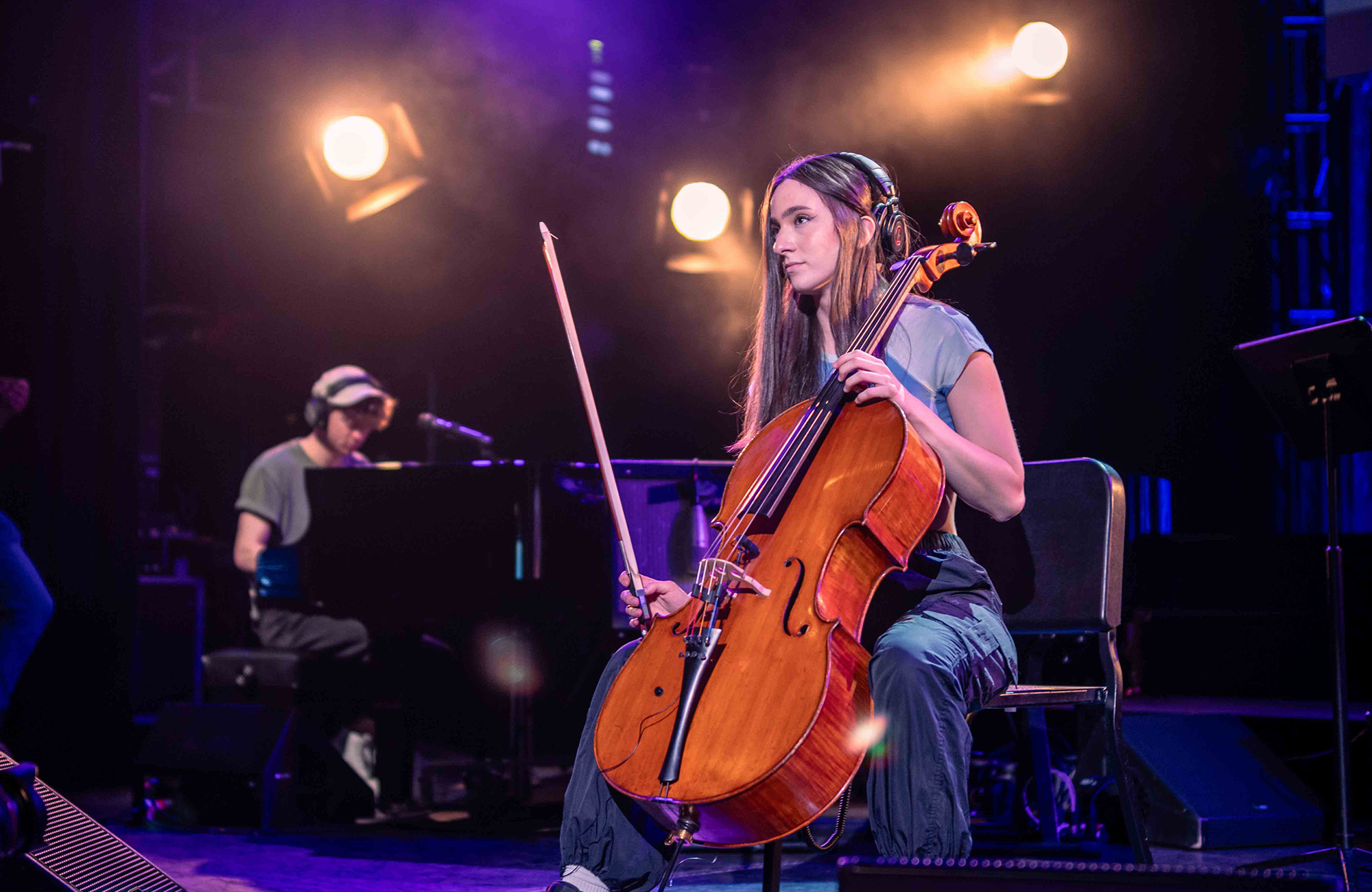 Elaina Spiro playing the cello on stage