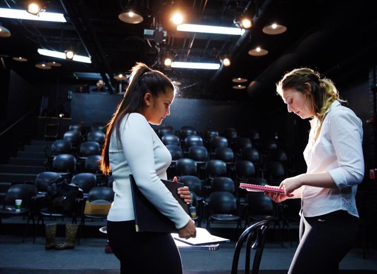 Students on rehearsing on stage
